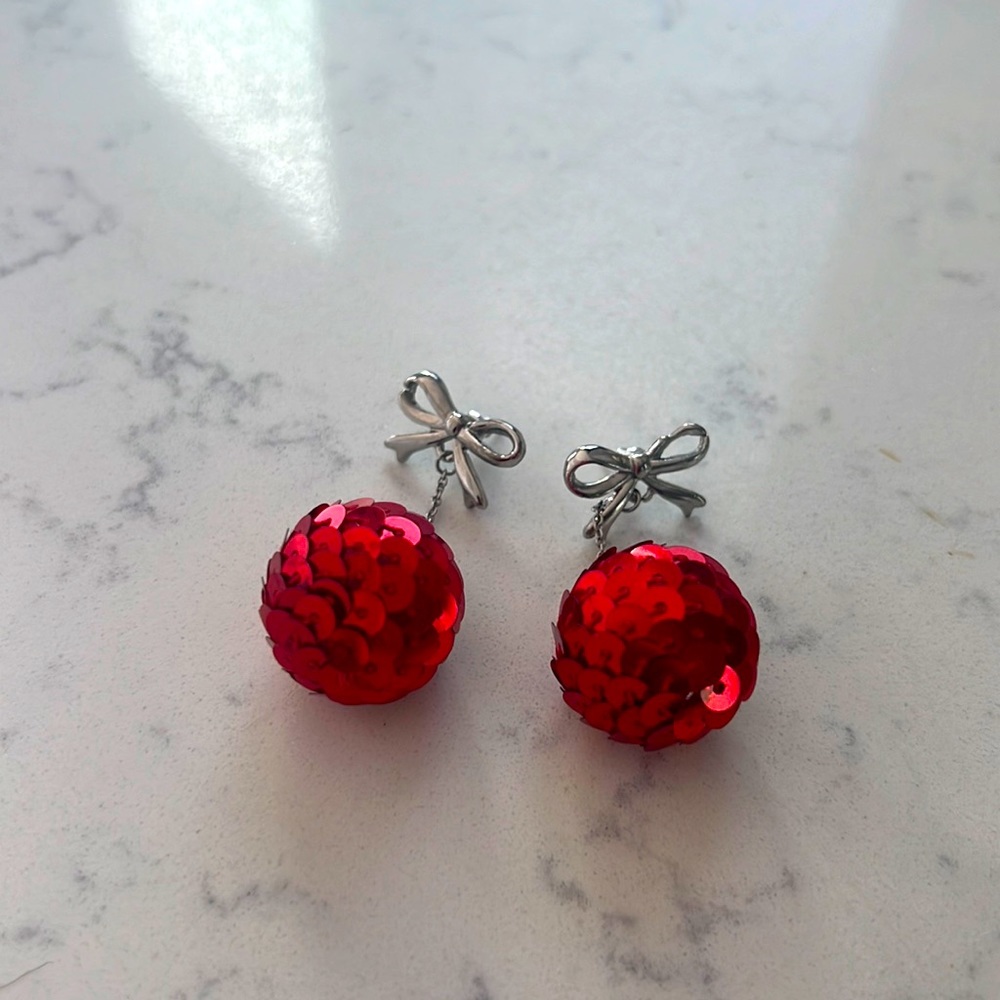 Christmas-themed earrings never worn